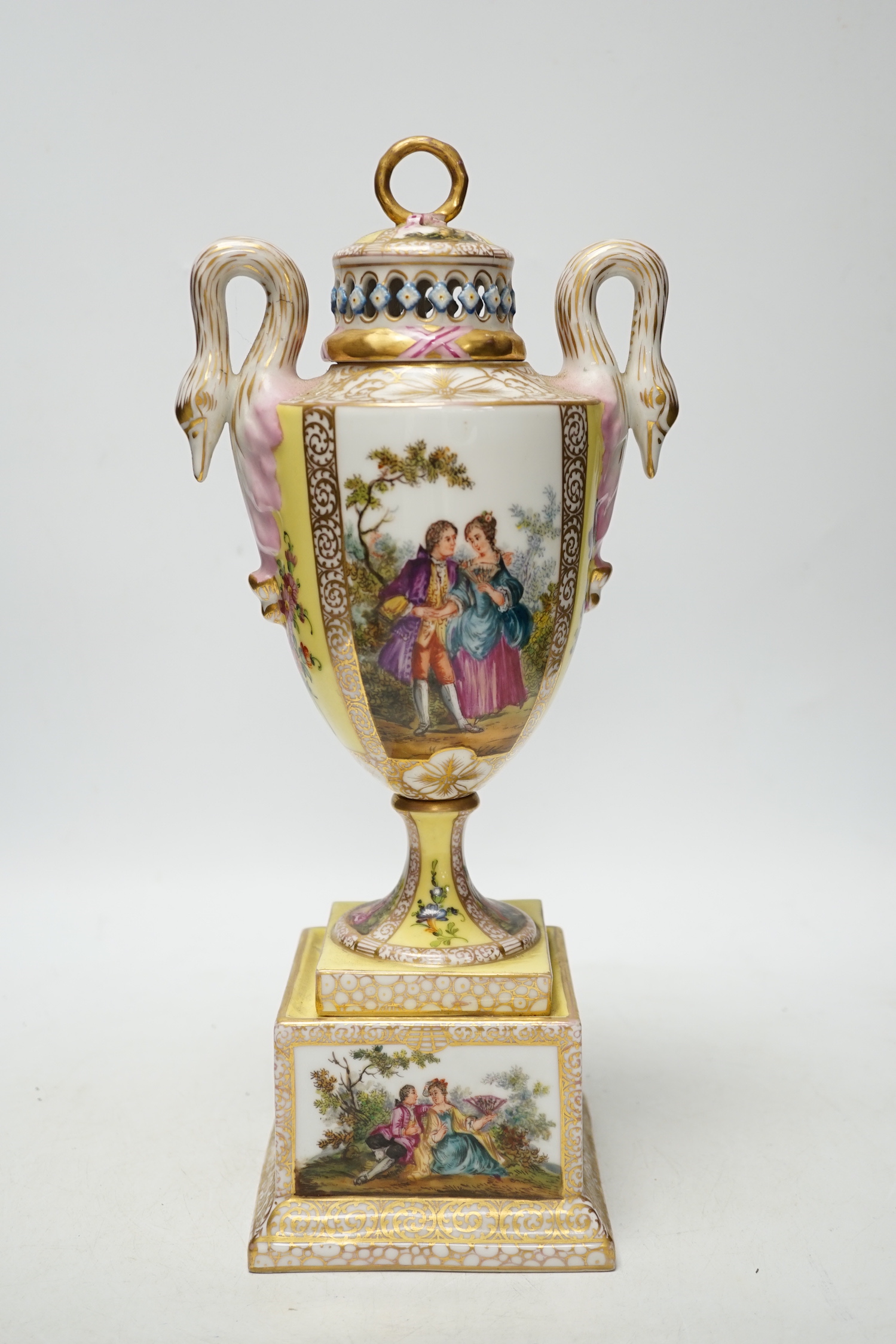 A Dresden yellow ground vase and cover with swan handles and figural cartouche, 36cm high